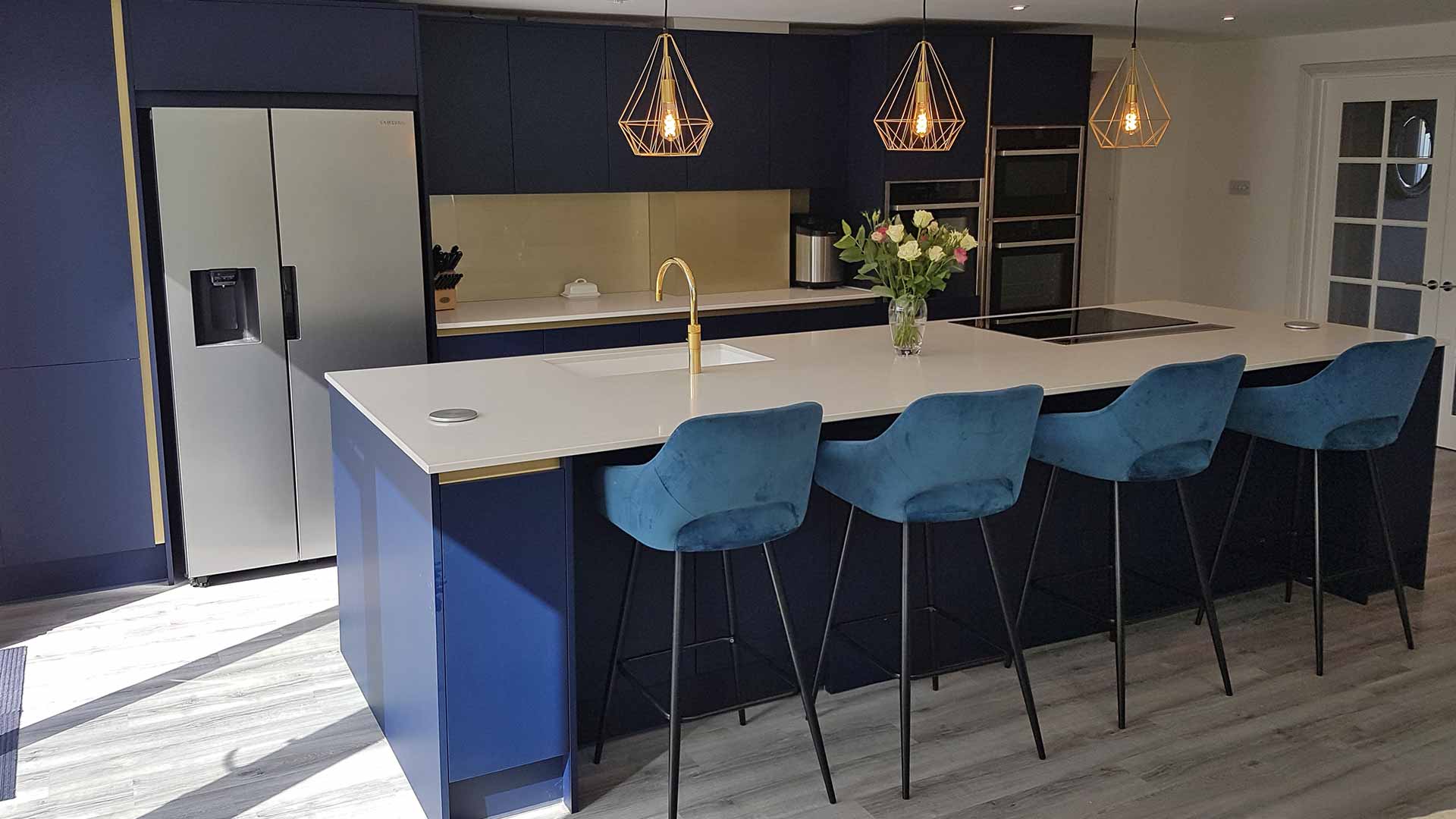 A dark blue kitchen in Esher