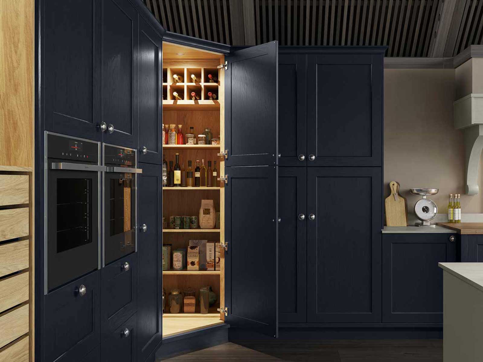 A pantry housed in Shaker kitchen cabinets in a modern colourful kitchen