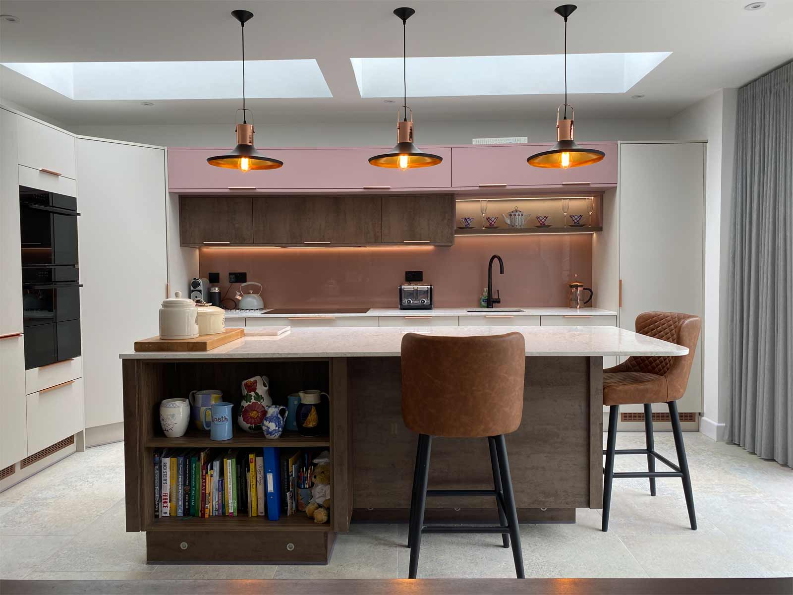 A Scandi interior kitchen in pink and grey with Danish furniture