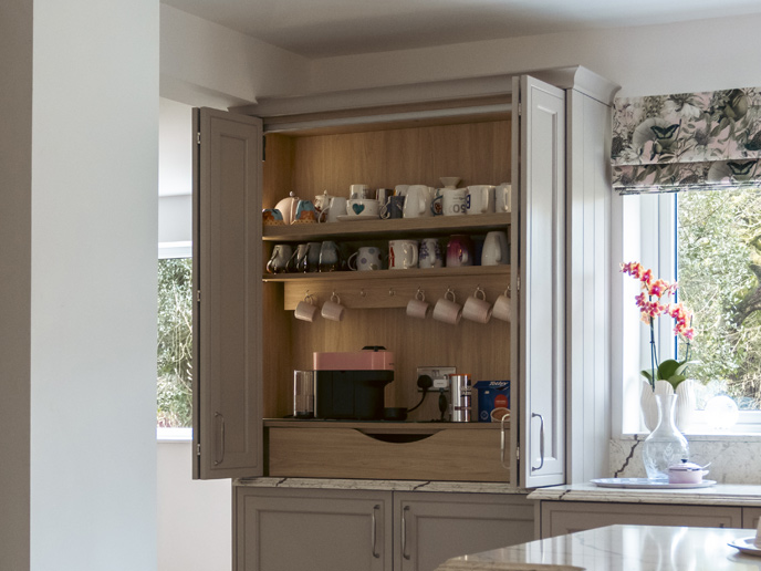 A breakfast kitchen dresser with light oak internal cabinetry