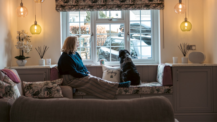 Adele and her spaniel-cross Sidney sitting on integrated in-frame seating