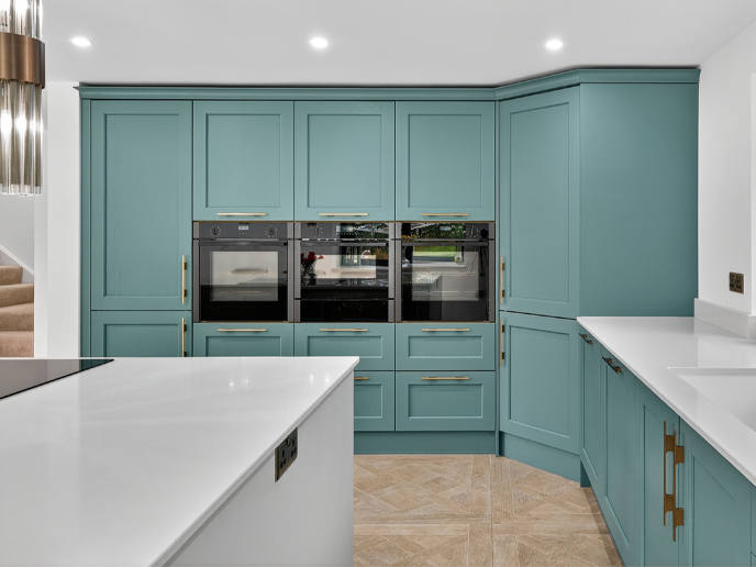 A kitchen extension full of tall larder units and integrated appliances