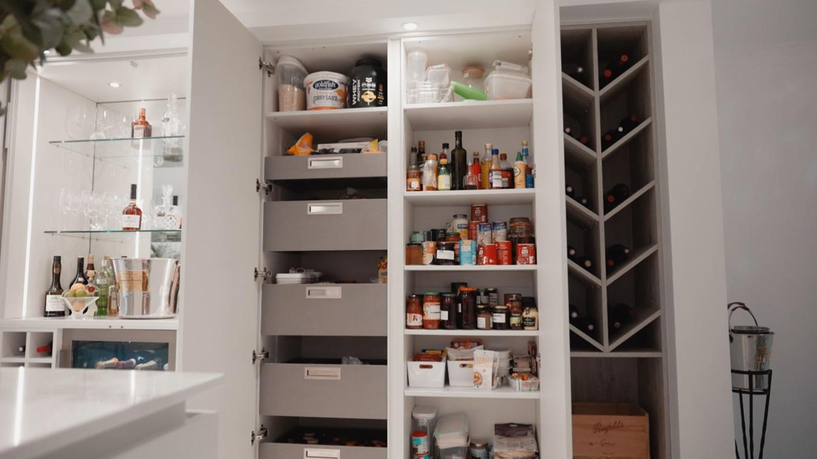 A wine rack with drawer options, also sporting a wine shelf rack for wine bottles