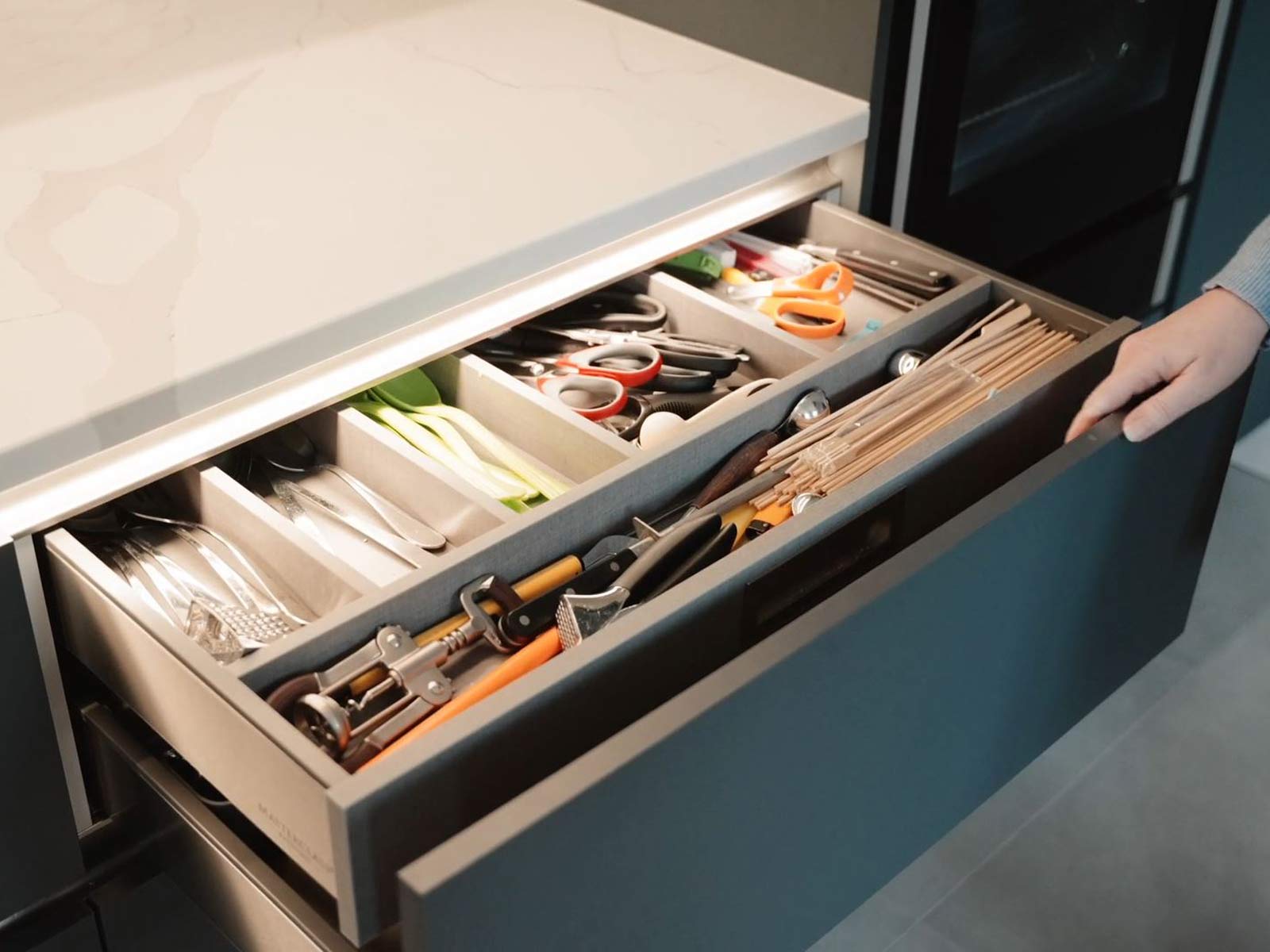 A metal storage drawer with a Blum Legrabox internal drawer