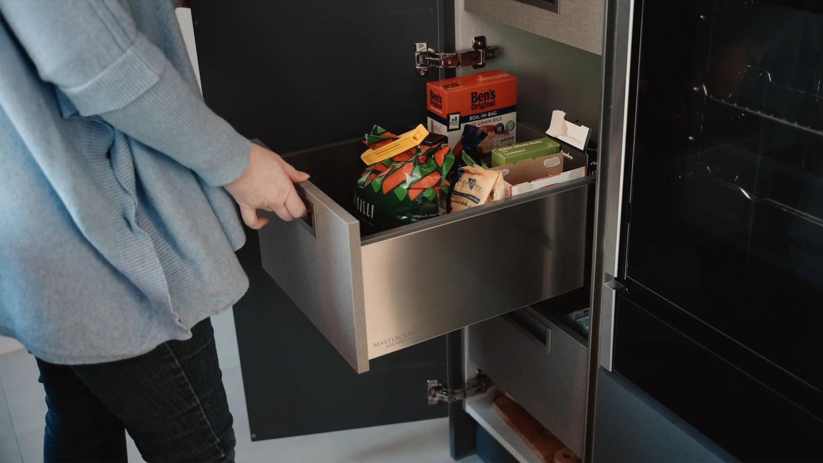 A SpaceTower larder acting as a kitchen unit pull-out storage solution