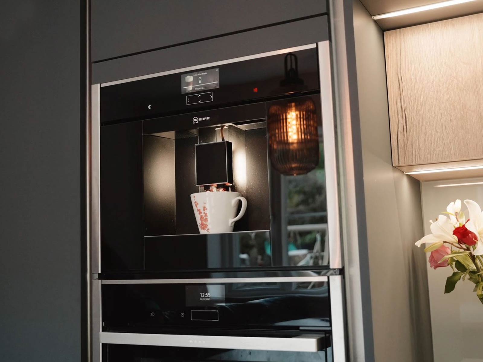 A Neff coffee machine built into a handless kitchen design