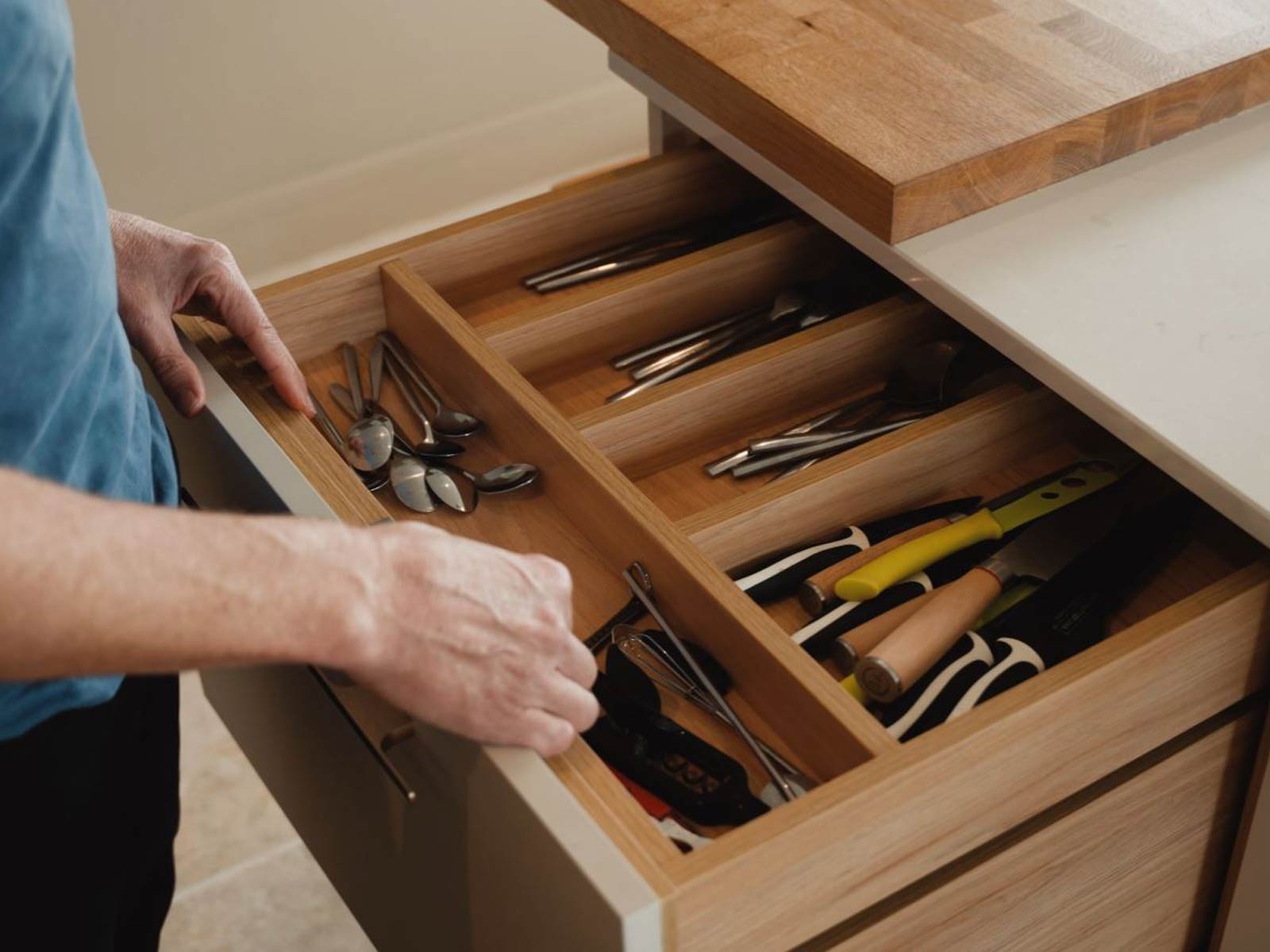 Ollie showcasing his luxury bespoke kitchen’s internal kitchen drawers