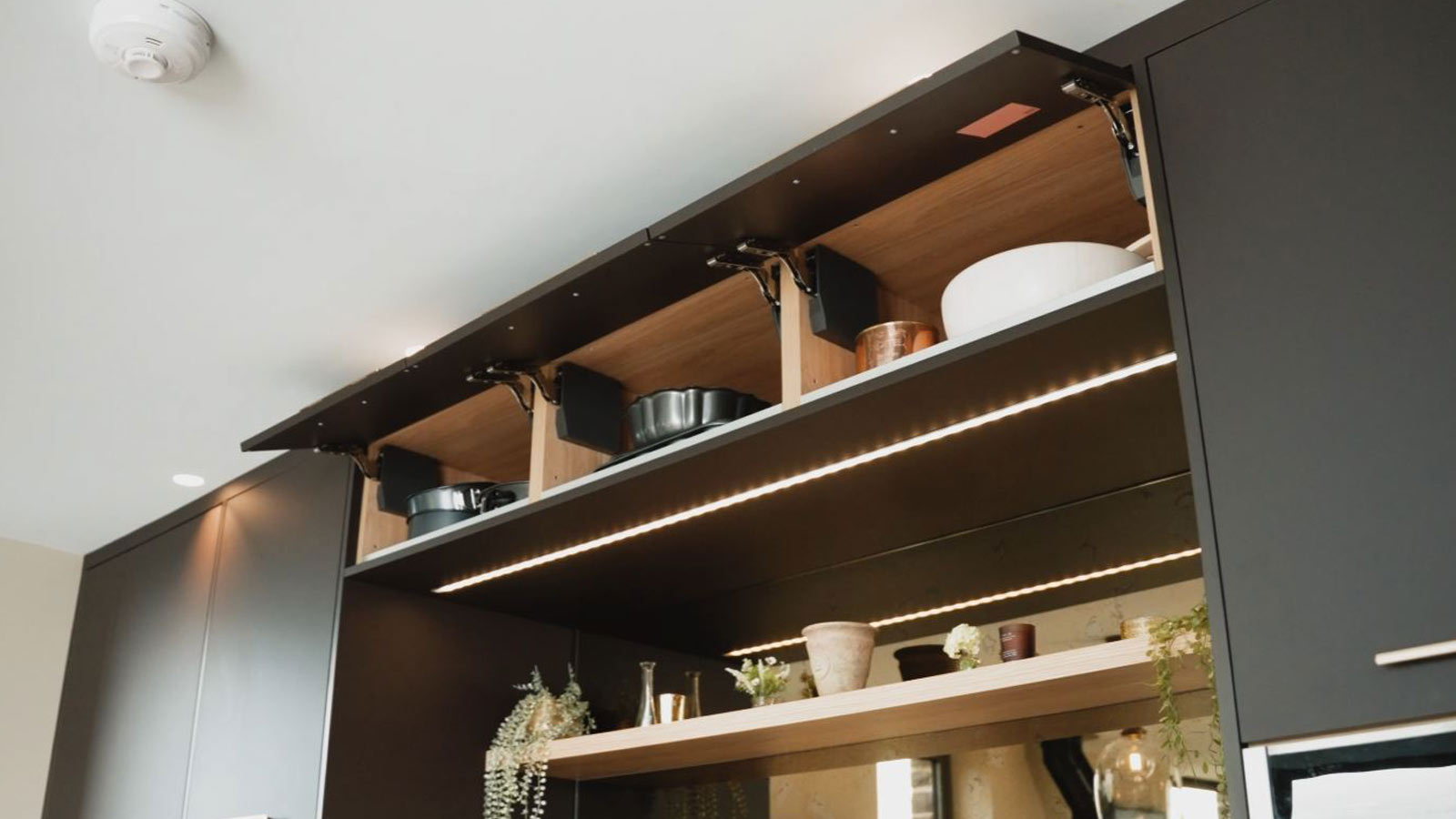 A unique kitchen design installation: extra-wide overhead cabinets