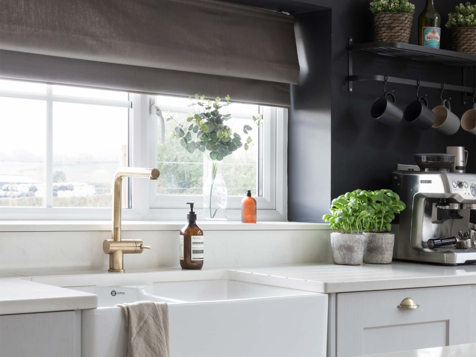 A Nancy Meyers kitchen featuring a Belfast sink