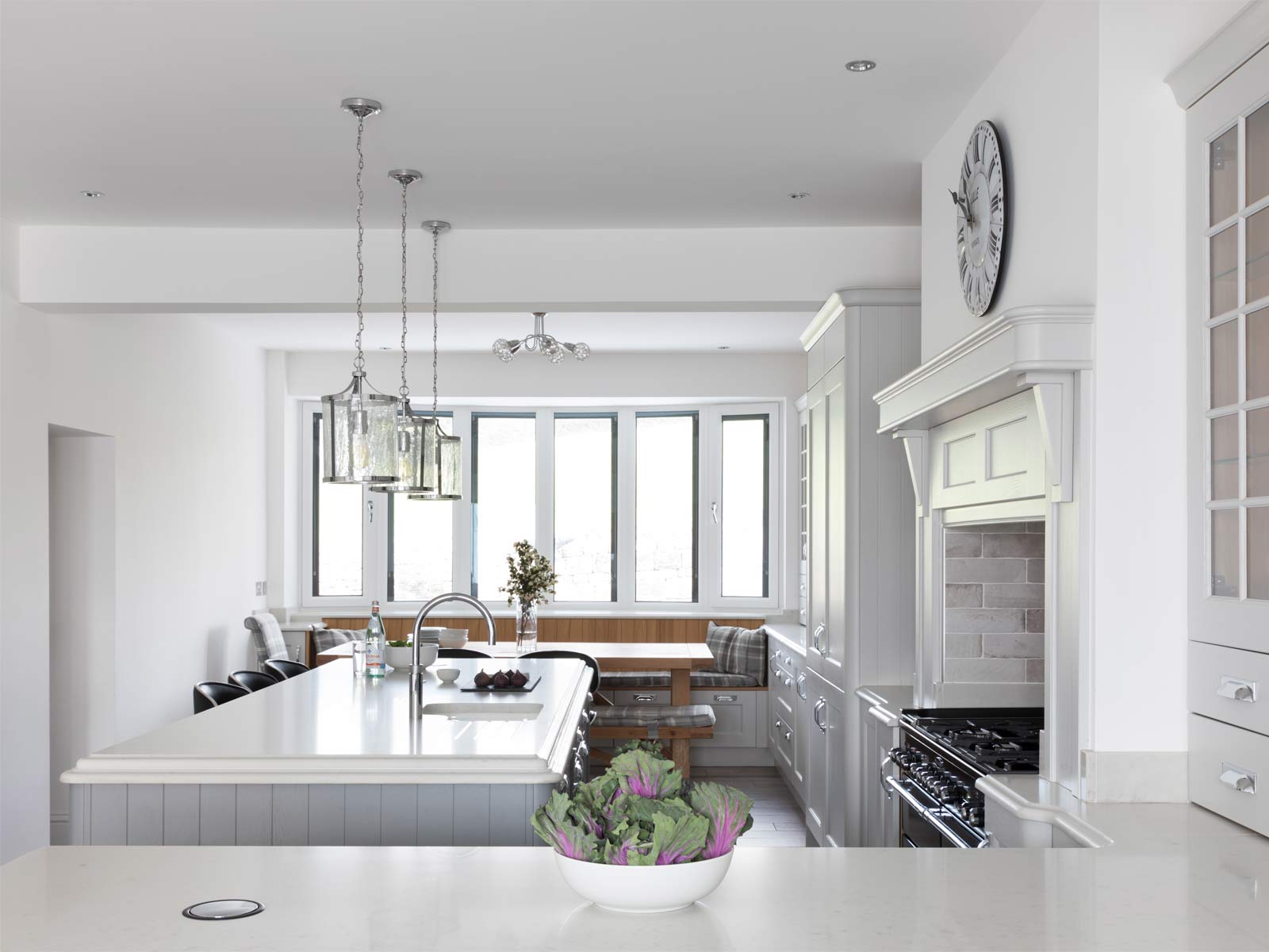 A bright coastal grandma kitchen with large kitchen windows