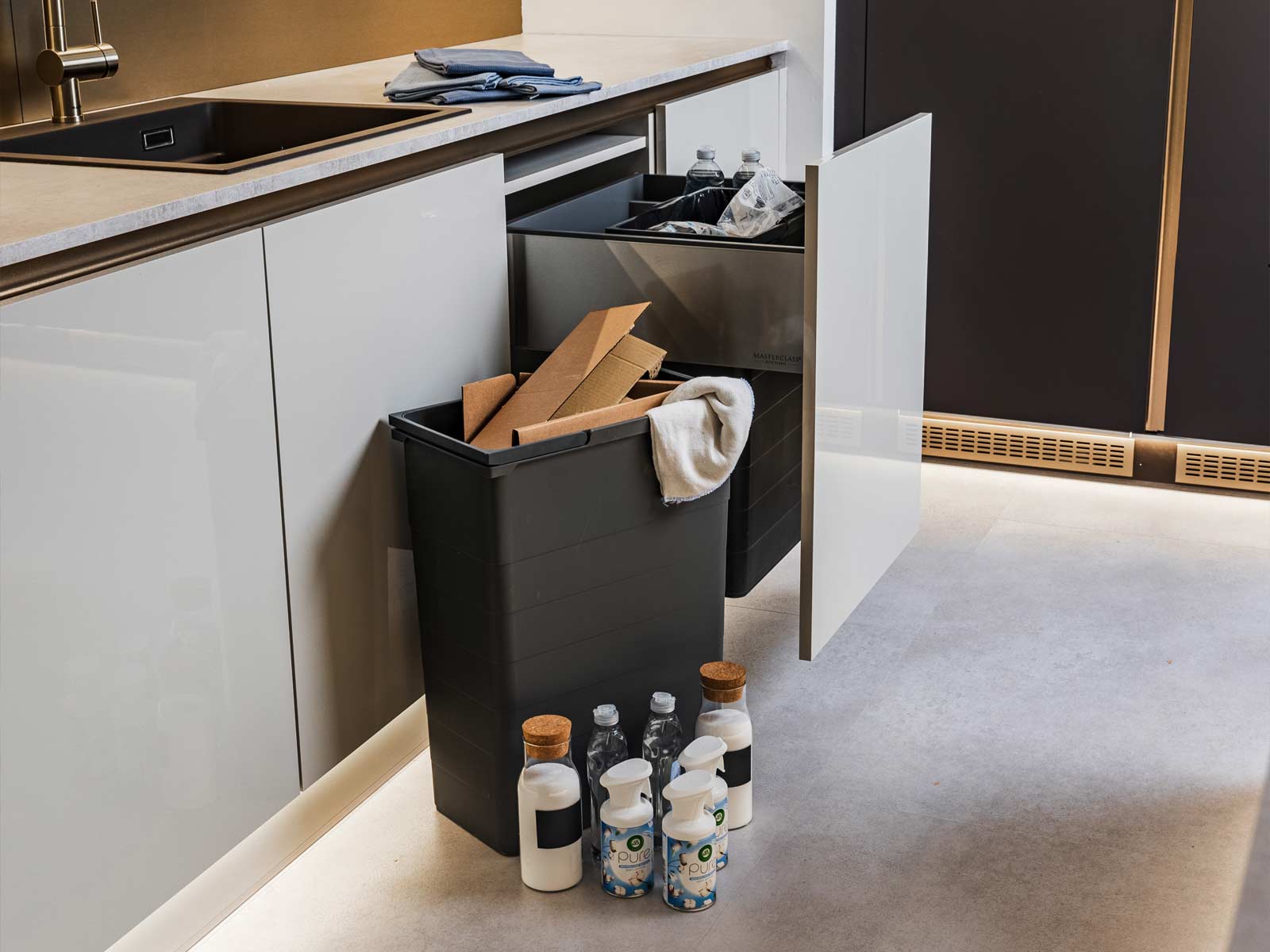 A Nordic-style kitchen with hidden kitchen bins