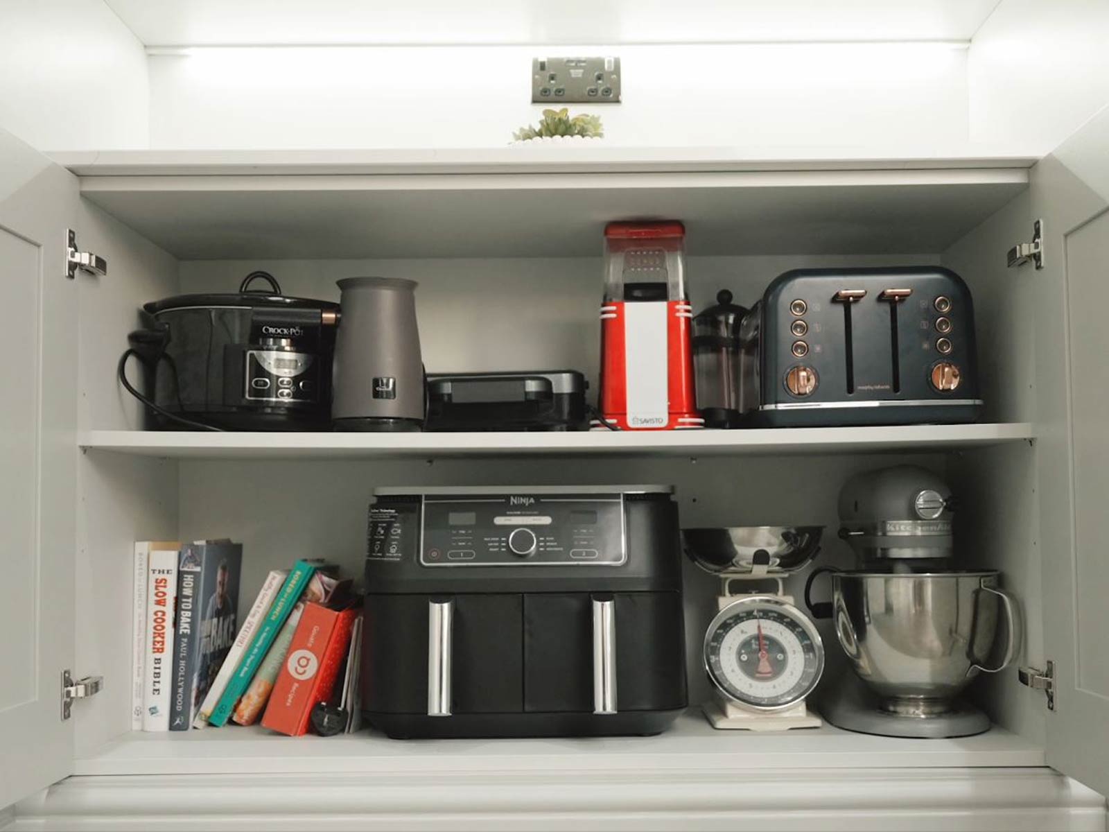 A wide, postless kitchen cabinet showing small kitchen cabinet storage ideas