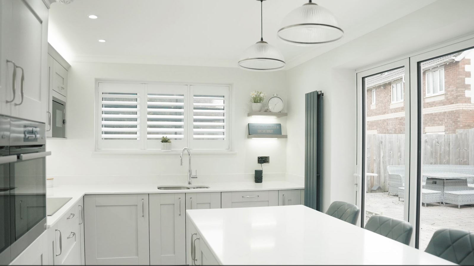 A grey and white show home kitchen