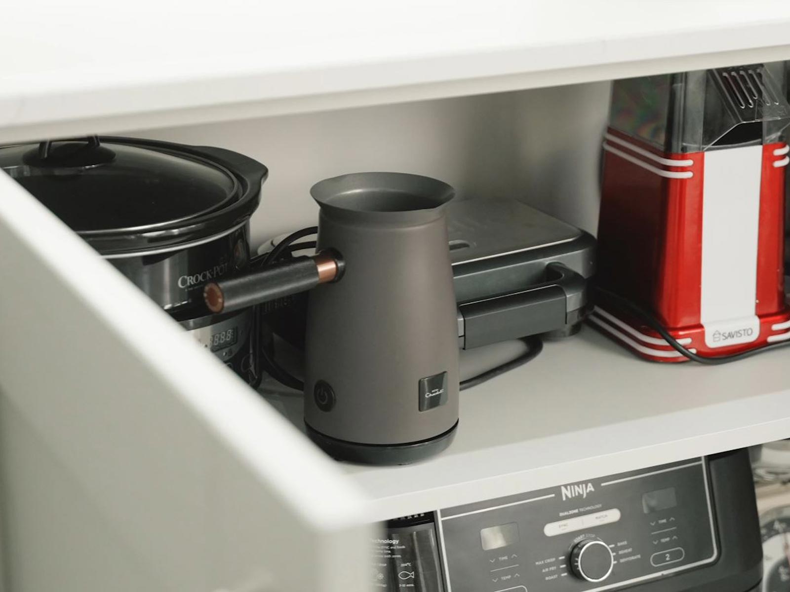 Under-sink storage solution shown as an extra-wide kitchen wall unit